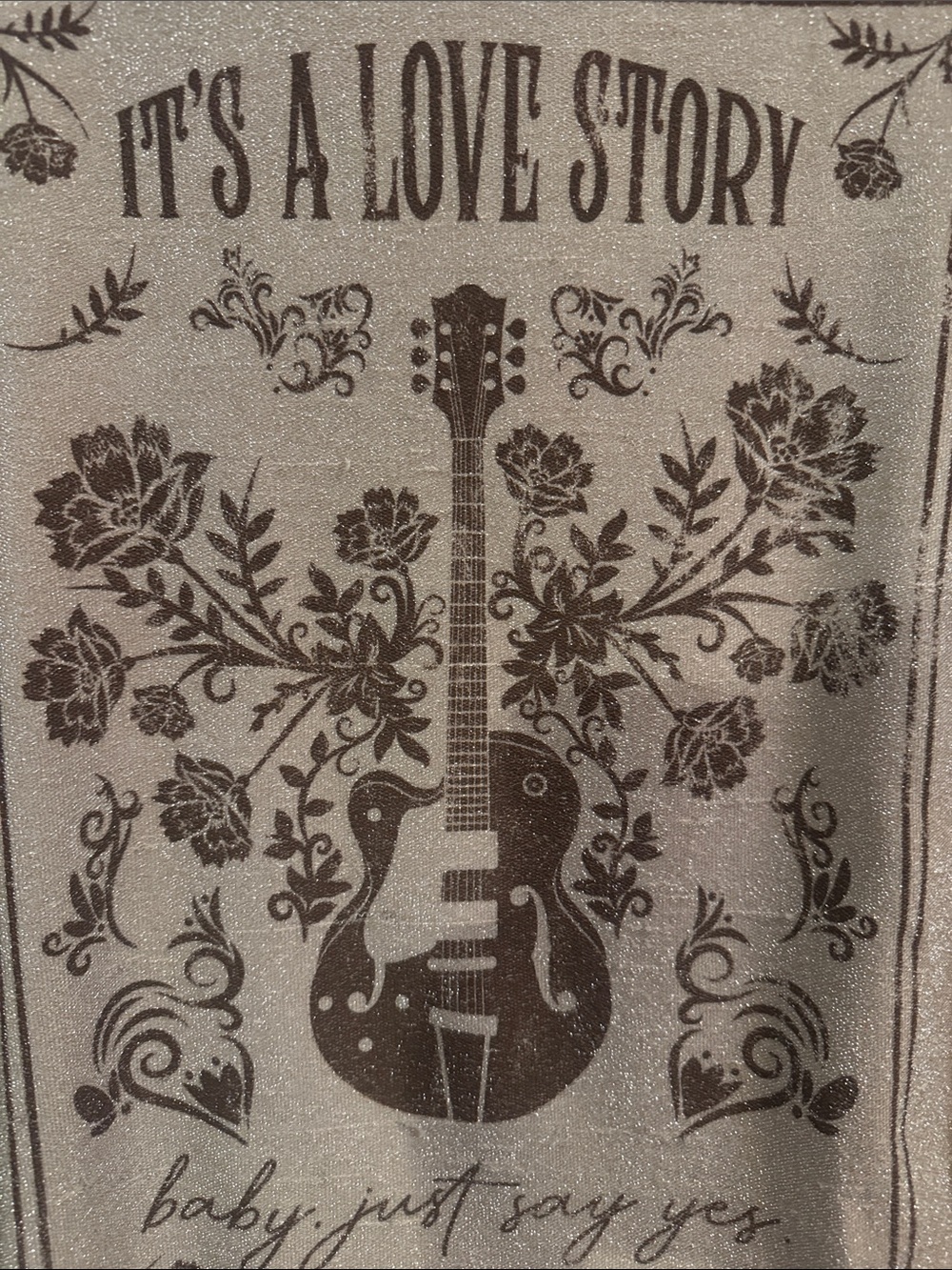 Graphic T-shirt  “It’s a Love Story” Gold sparkle.